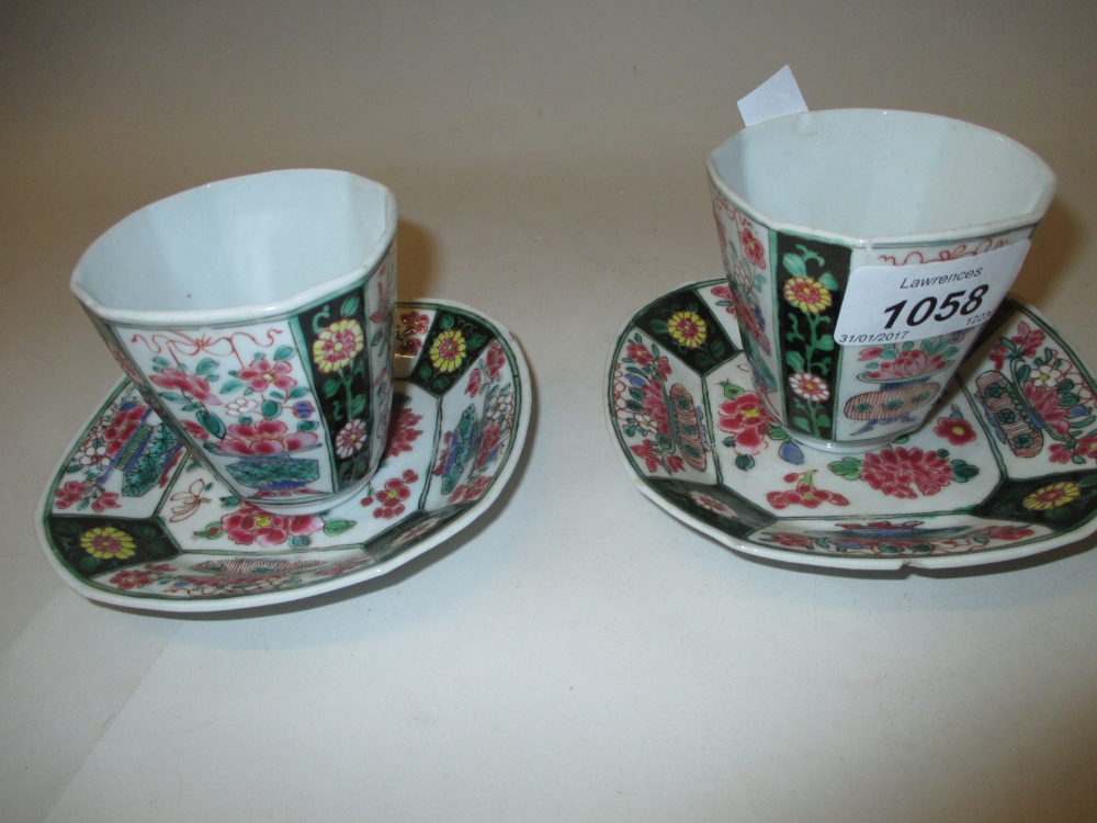 Pair of Chinese famille verte tea bowls and saucers of irregular octagonal form,