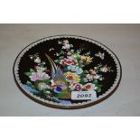 Small cloisonne dish decorated with an exotic bird and flowers on a black ground,