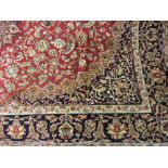 Red ground machine woven Kashan rug, 1.9m x 1.