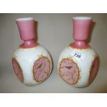 Pair of Victorian pink and white opaque glass vases decorated with flowers and insects