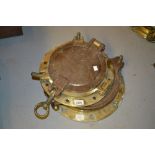 Ships brass and steel porthole cover together with another similar