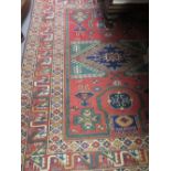 Modern Turkish Caucasian design rug with a geometric design on rose ground with multiple border,