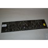 Small 19th Century bronze relief work panel depicting putti engaged in sculpture,