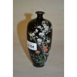 Japanese cloisonne baluster form vase with prunus blossom and floral decoration on a black ground,