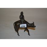 Chinese dark patinated bronze censer in the form of a figure riding an ox