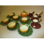 Sarreguemines six place setting tea service in the form of oranges together with four coffee cans