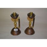 Pair of Arts and Crafts brass and copper candlesticks in the manner of Dresser