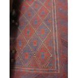 20th Century Belouch style rug with part flat weave geometric design in shades of wine red and blue,