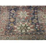 Shirvan rug with a multiple medallion design on a blue ground with borders (worn),