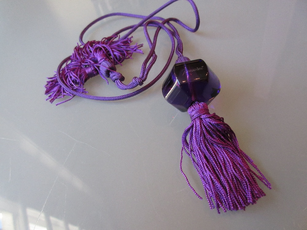 Baccarat mauve glass pendant on matching cord in original box with certificate