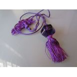 Baccarat mauve glass pendant on matching cord in original box with certificate