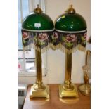 Pair of brass Corinthian column table lamps with green glass shades