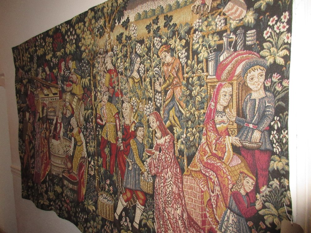 Reproduction machine woven tapestry wall hanging depicting a wine making scene,