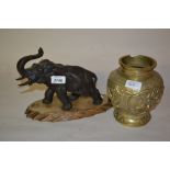 Japanese brown patinated bronze figure of an elephant on a hardwood base,
