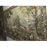 Machine woven tapestry wall hanging depicting a landscape within a floral border,