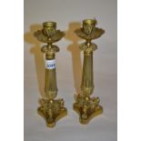 Pair of Regency style gilt brass candlesticks with acanthus sconces,