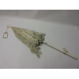 Victorian lace and silk parasol with a wooden handle and ivory loop