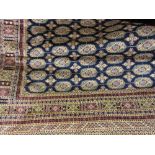 Blue ground machine made Bokhara style rug, 1.90m x 1.