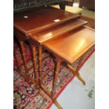 Nest of three reproduction rectangular mahogany occasional tables on twin turned end supports