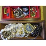 Two jewellery boxes containing a quantity of various costume jewellery