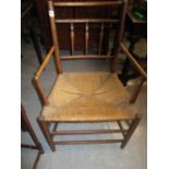 19th Century Sussex open armchair having spindle back raised on turned supports