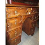 Late 18th / early 19th Century oak kneehole desk with seven geometric moulded drawers and central