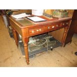 Victorian mahogany writing table with sectional green leather inset top,