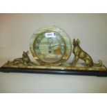Art Deco black slate and green onyx mantel clock mounted with gilded figures of dogs together with