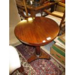 Victorian rosewood circular pedestal table with a plain turned column support and tri form base