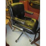 Gordon Russell black leather revolving office desk chair on adjustable base