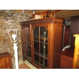 Early 20th Century mahogany two door bookcase with a key pattern frieze