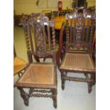 Pair of 19th Century carved oak side chairs with barley twist uprights and cane seats
