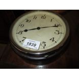 Small circular Bakelite cased bulk head clock with a hinged chrome plated bezel,