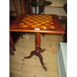 19th Century mahogany and inlaid pedestal games table with a chequer board top above a turned