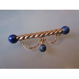 Continental gold lapis lazuli set bar brooch