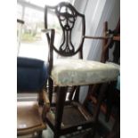 Mahogany shield back open armchair on square tapering front supports,