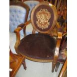 Late 19th or early 20th Century Continental carved walnut open armchair with a needlepoint back,