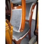 Pair of Victorian oak side chairs with padded backs and overstuffed seats on turned front supports,