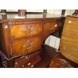 Early 20th Century mahogany semi bow fronted five drawer kneehole dressing table raised on square