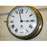 Mahogany and brass ship's bulk head clock, the enamel dial with Roman numerals, signed Smiths,
