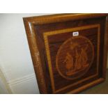 Walnut and satinwood framed parquetry picture of figures beneath a palm tree