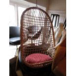 Mid 20th Century cane work egg form hanging chair