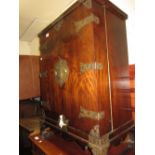 Pair of 20th Century Chinese elm and brass mounted two door side cabinets