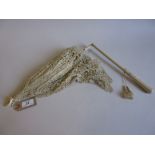 Victorian lace and silk parasol with a wooden handle and ivory loop