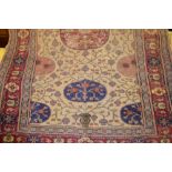 Anatolian rug with medallion and all-over stylised floral design on a beige ground with borders