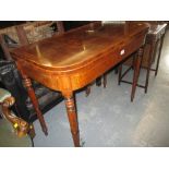Late George III mahogany crossbanded and line inlaid D shaped fold-over card table on turned