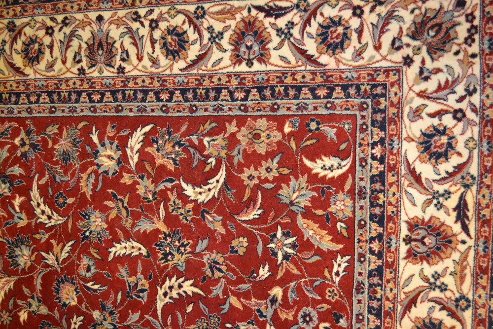 Machine woven Persian design carpet with floral pattern on red ground together with another similar - Image 2 of 2