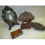 Black Forest carved oval easel mirror, similar folding shelf and dish,