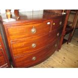 George III mahogany bow fronted chest of two short and two long drawers with circular brass ring