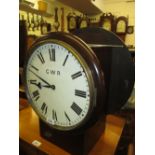 Oak and mahogany double sided station clock, the circular painted dials with Roman numerals,